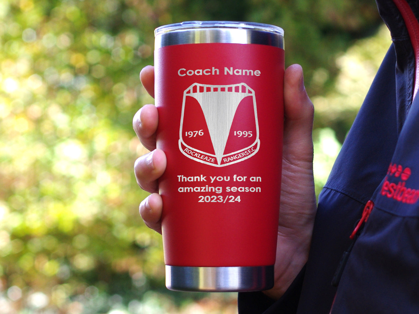 Coach thank you gift. Orange travel mug personalised with name club badge and message