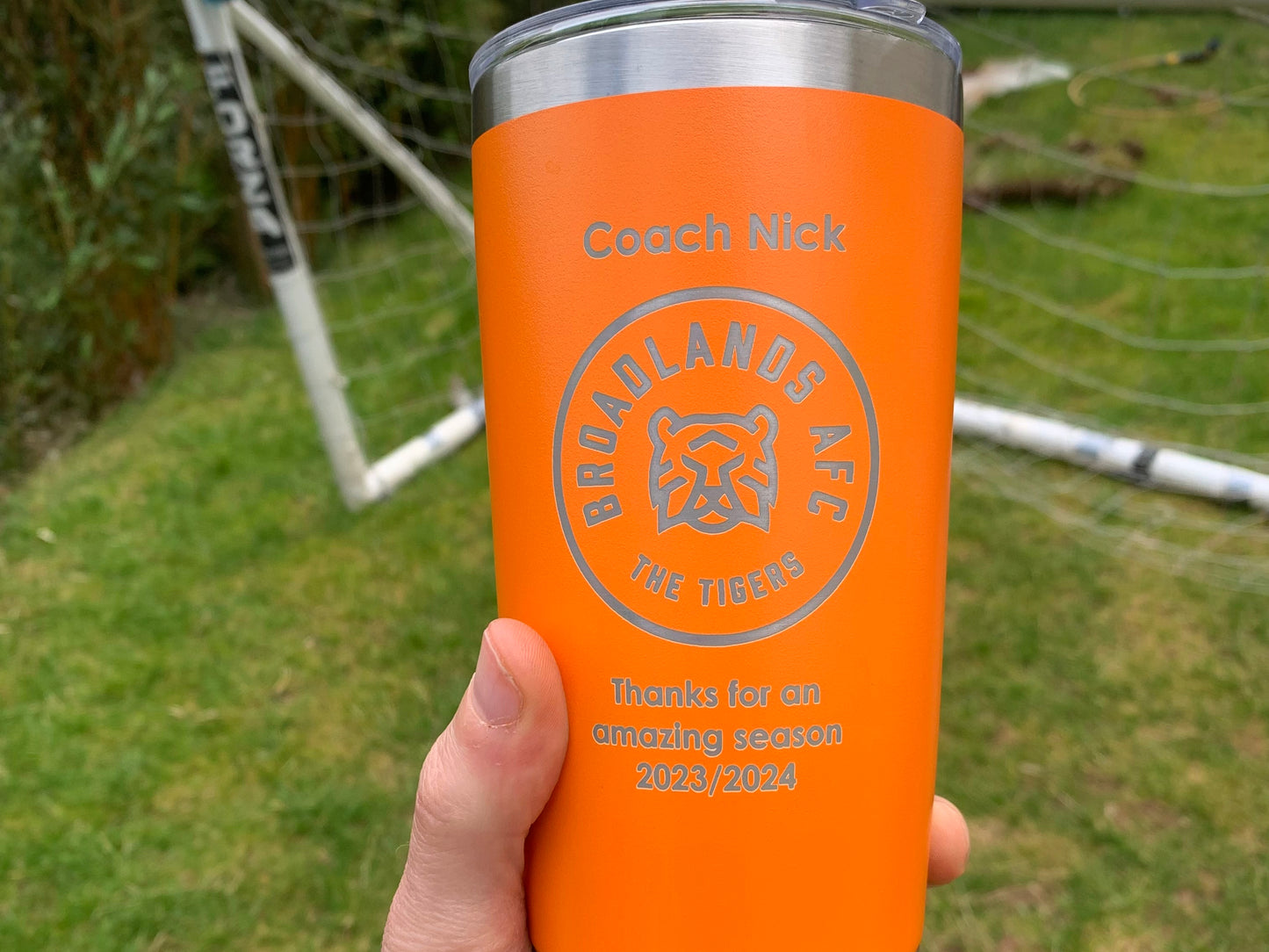Coach thank you gift. Orange travel mug personalised with name club badge and message