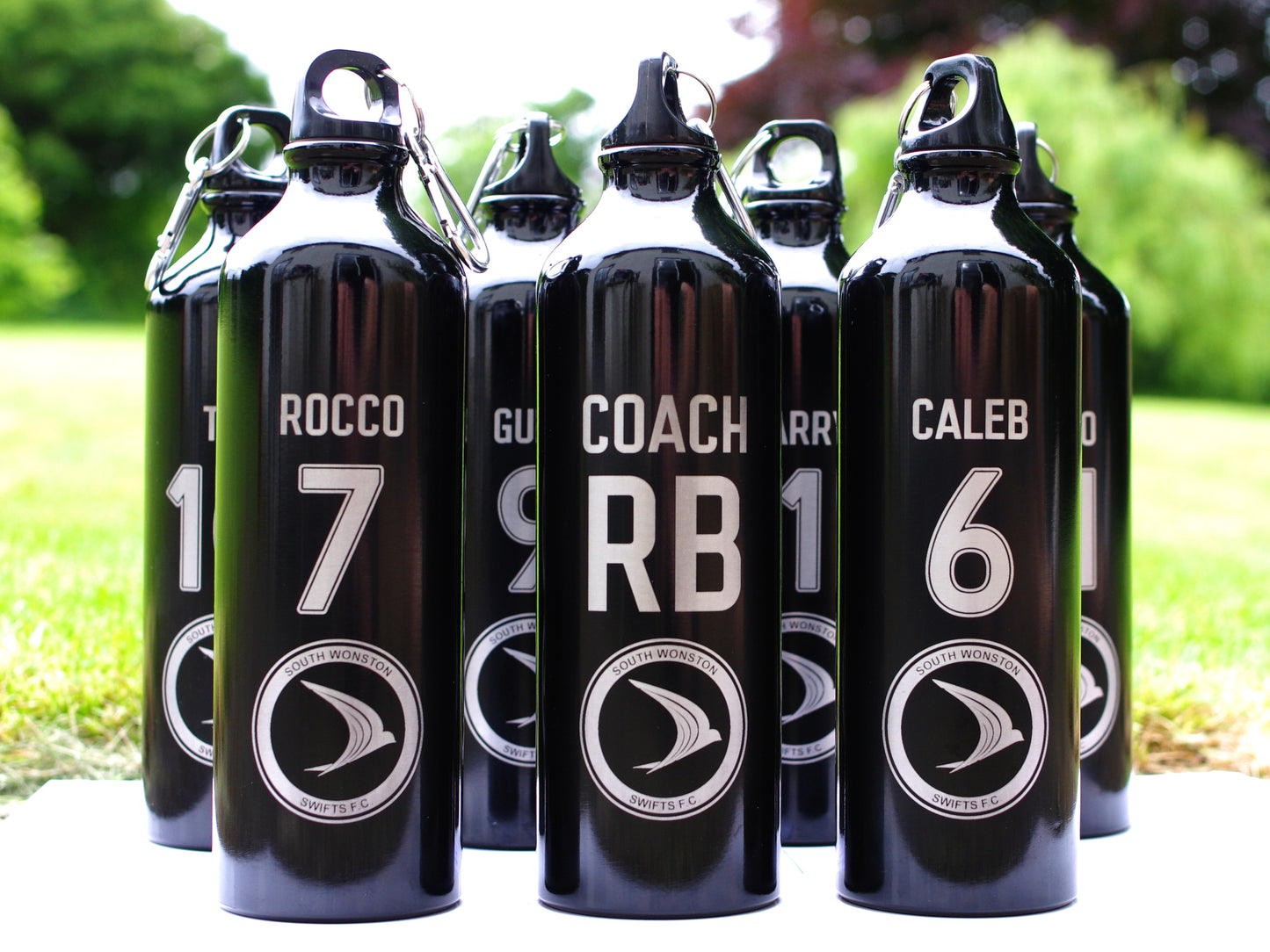 Personalised water bottle with player name and number club crest