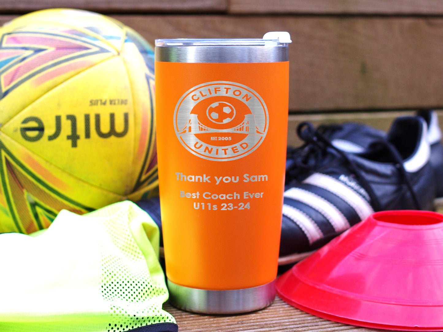 Coach thank you gift. Orange travel mug personalised with name club badge and message